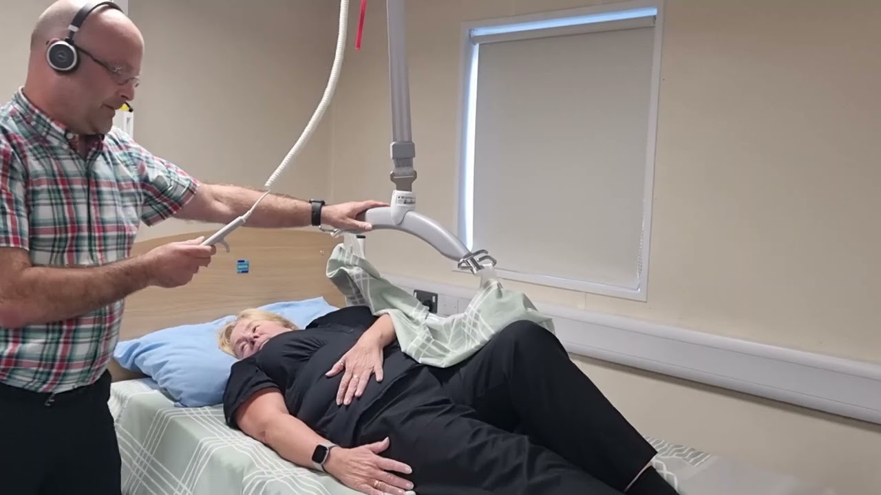 Rolling a Person in Bed using Satin Sheets and Passive Hoist