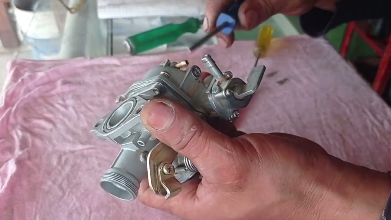 cómo reparar un carburador de una moto akt 110