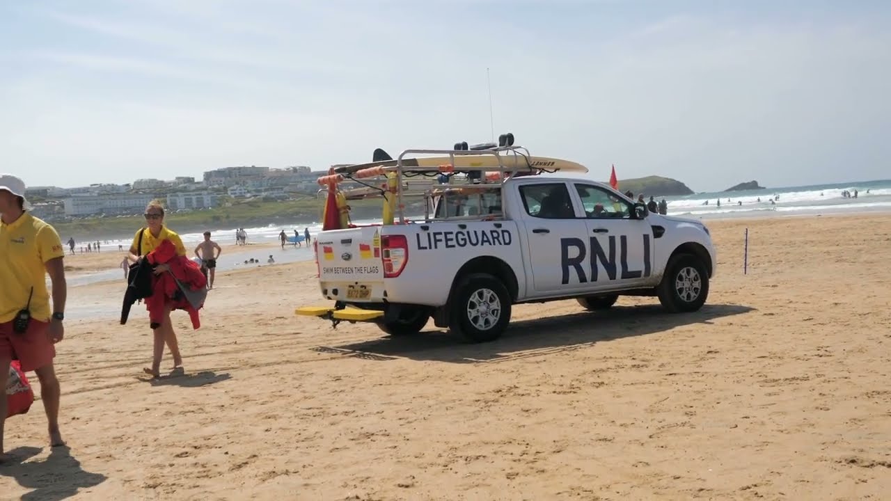 Humans lie stranded on a beach awaiting tide to carry them off.