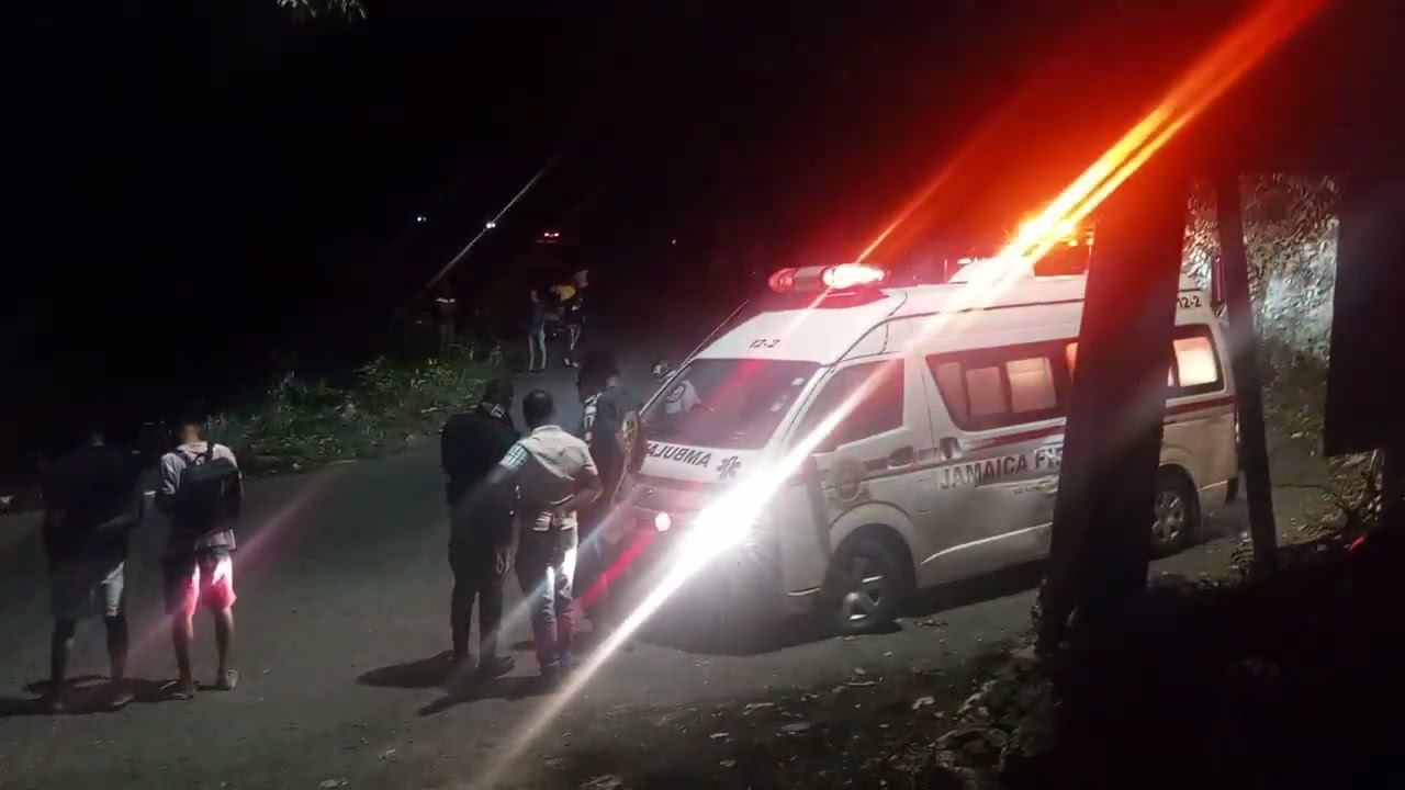 A mini bus  turns over in flat bridge