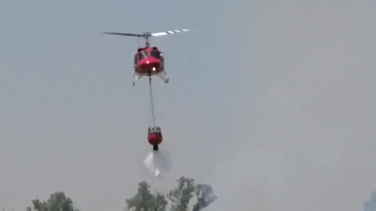 Raw: Helicopter Water Drop Over Par Fire