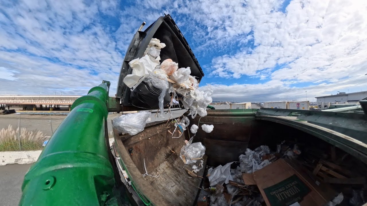 Waste Management front load commercial garbage truck 