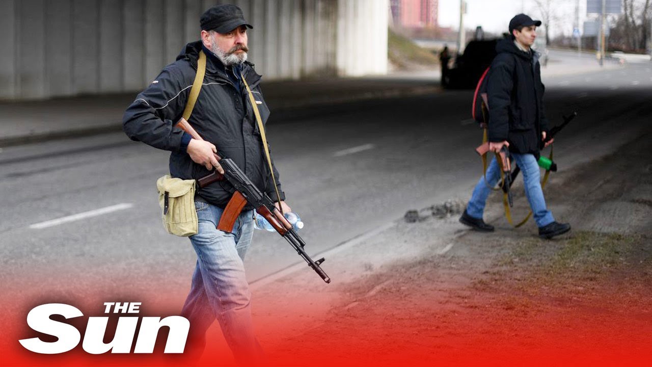 Russian invasion - Ukrainians & foreign men line up for weapons to defend Kyiv