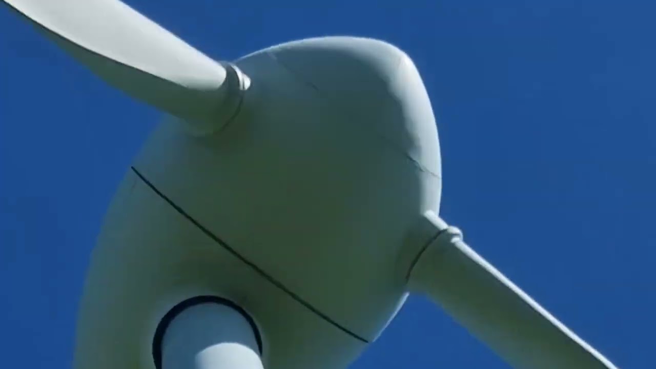 An enercon E-40 wind turbine with a strange name and som other vestas wind turbines
