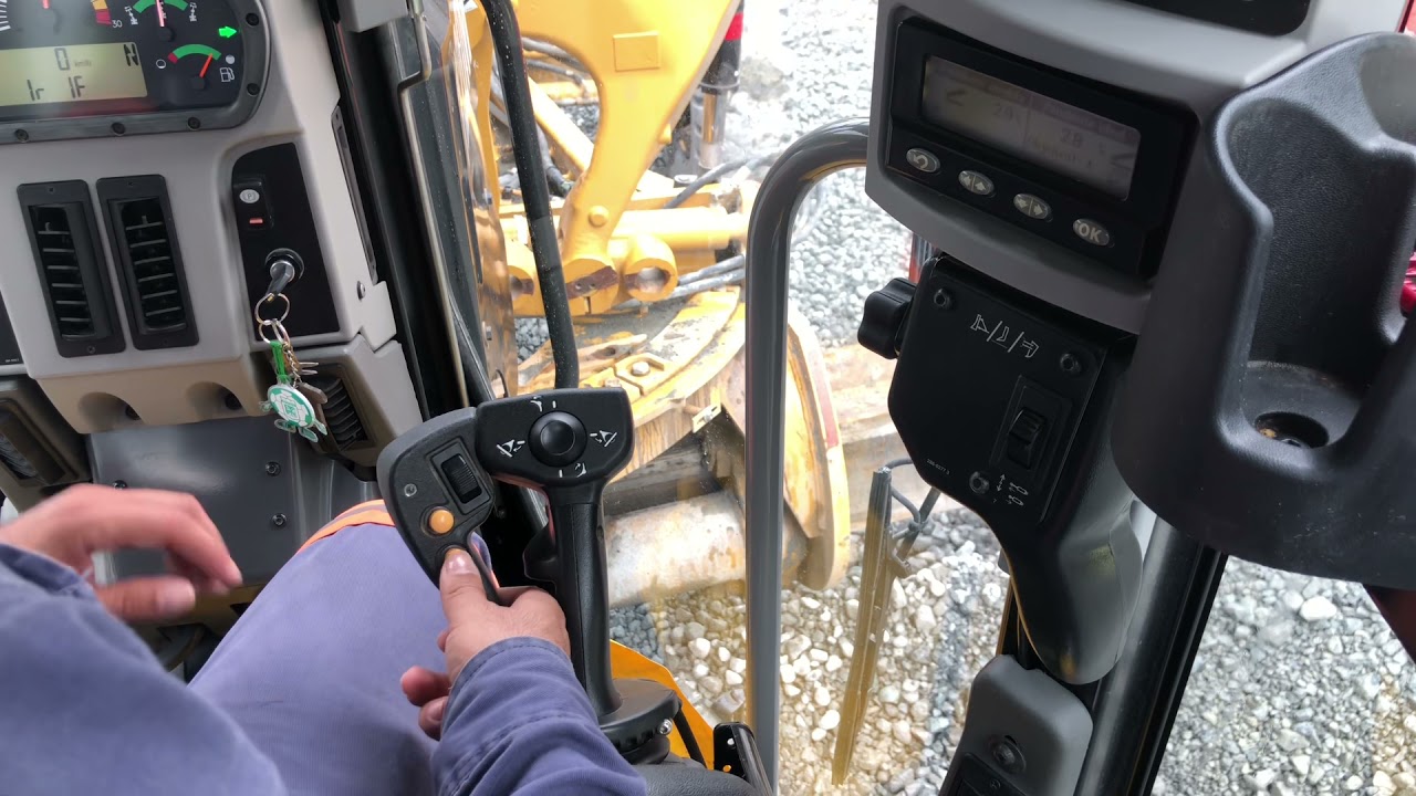 Programación de pendiente transversal en motoniveladora Cat 120M