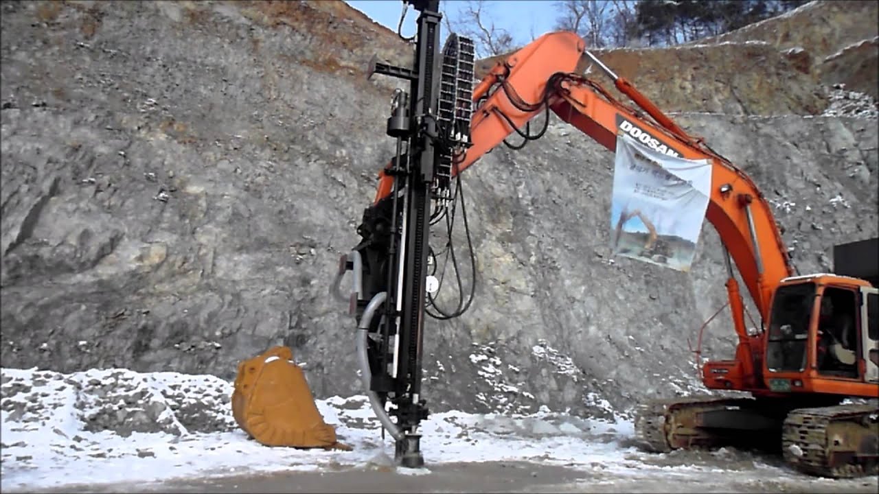 Rock drill for excavator