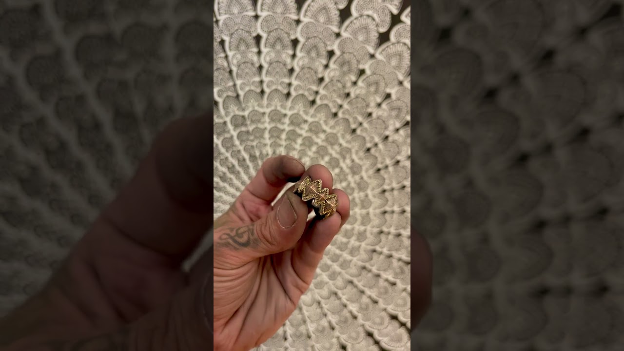 20K gold micro-granulation, shakudo, sterling silver. 
