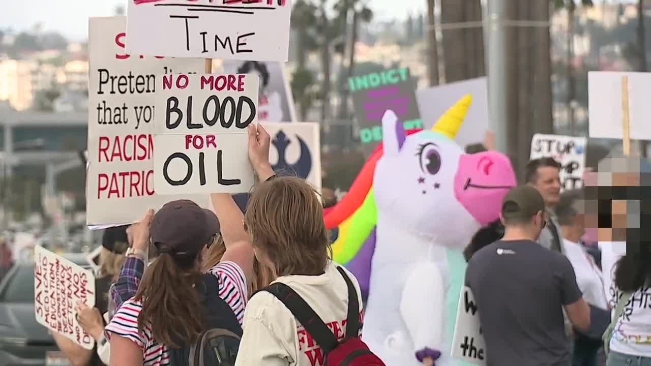 Protesters gather and rally on the one-year-anniversary of Trump's second term