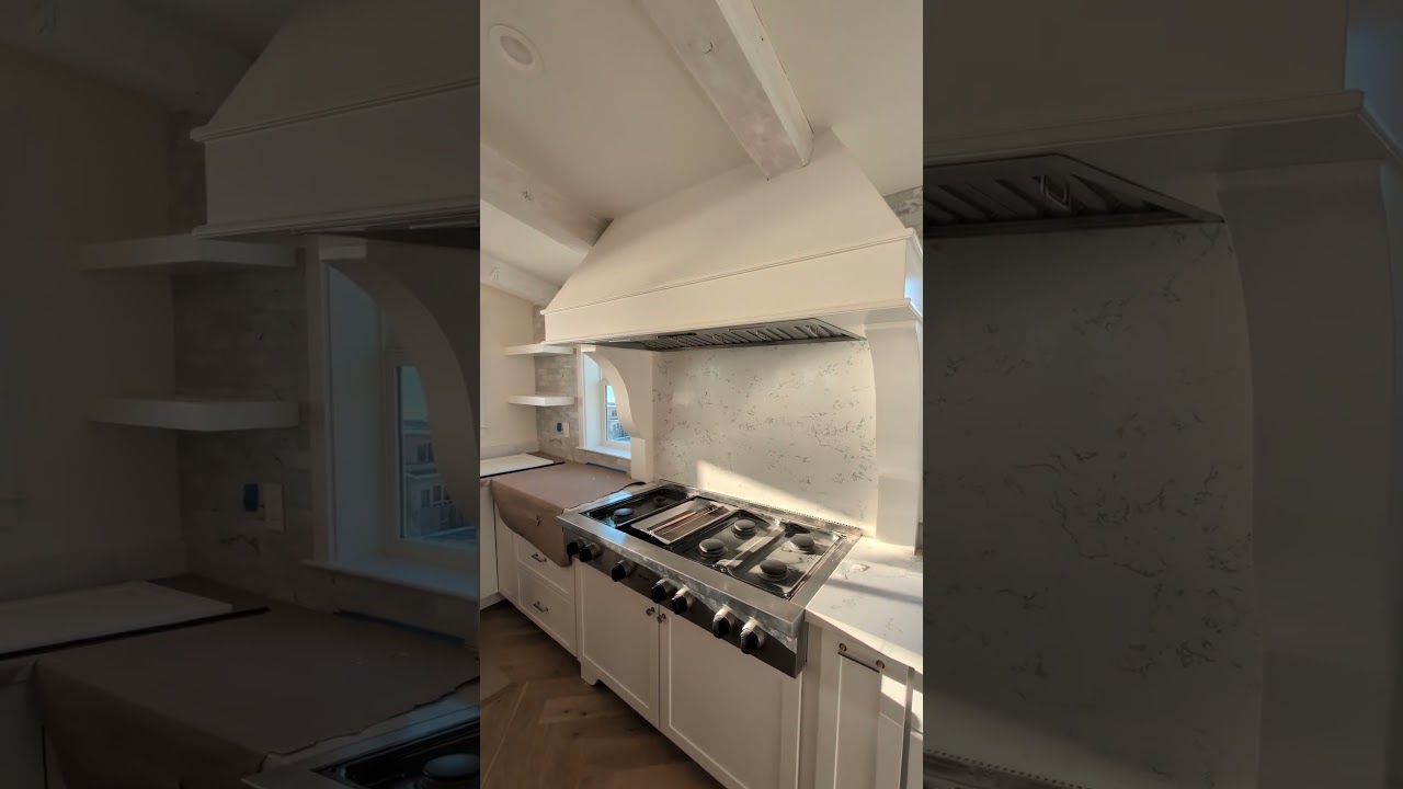 Ocean View Dream Kitchen with Custom Hood & Built-In Fridge/Freezer