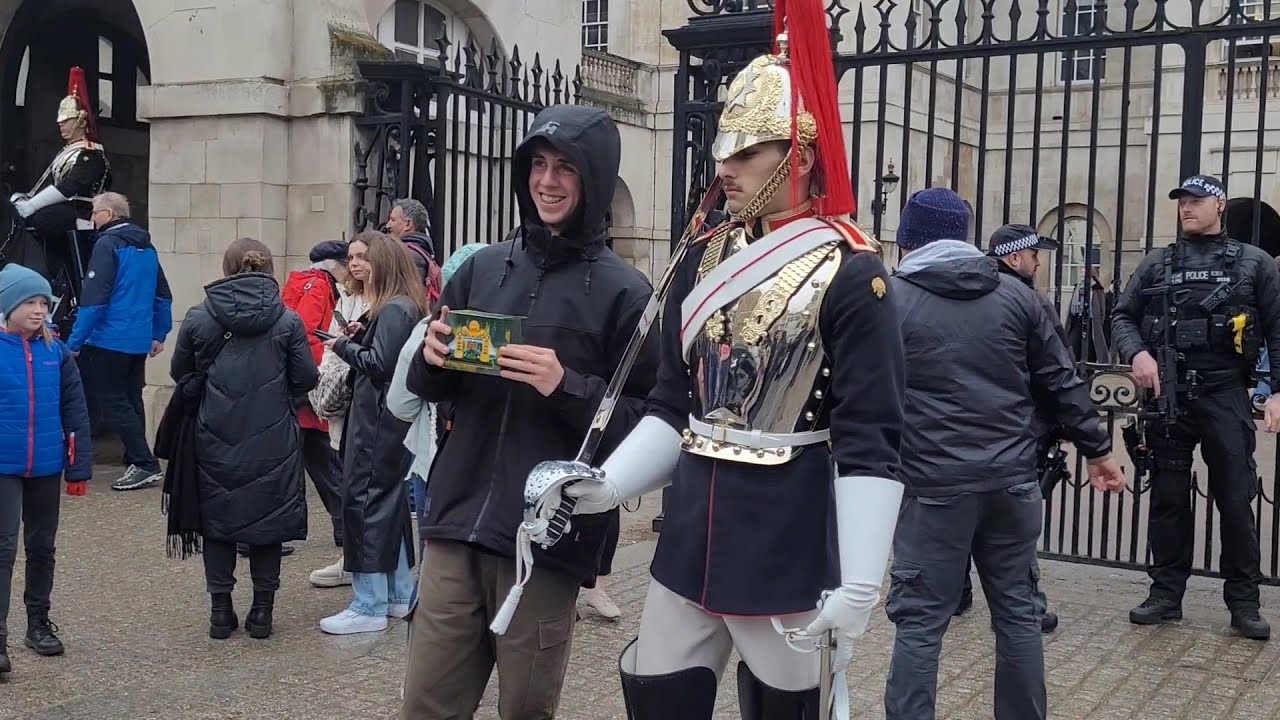 Piss taking tourist pulls something out of his coat #horseguardsparade