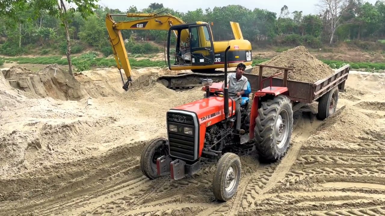 All My Tractors Arrived Together In The Field, Loaded By A Backhoe Machine, Then Left With The Load