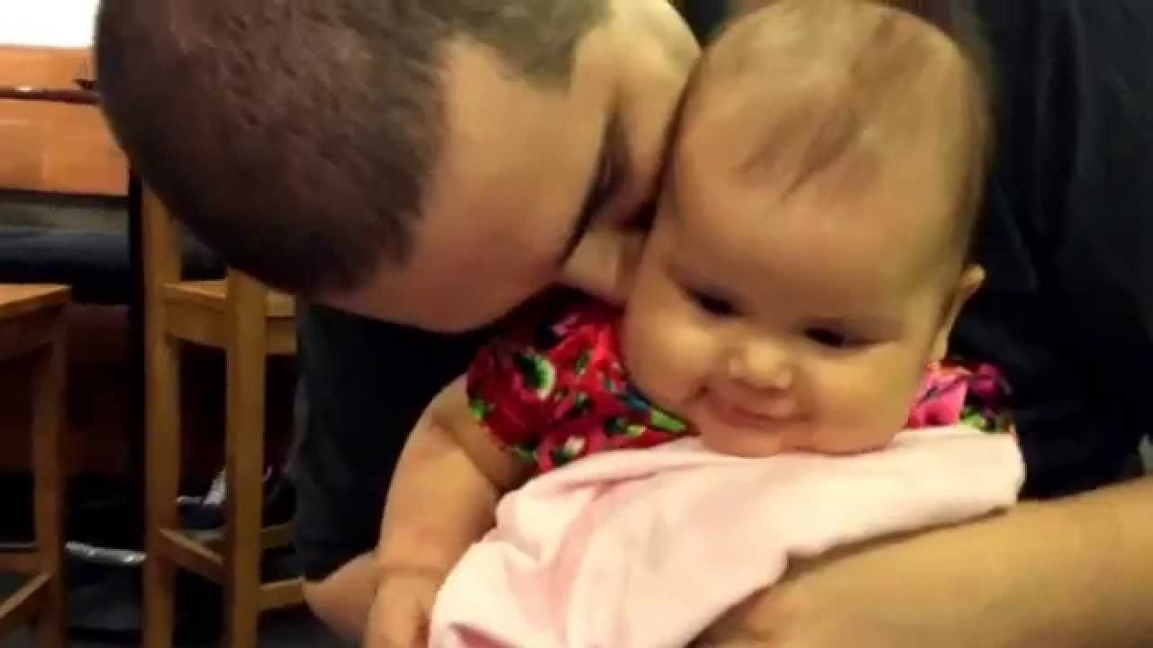 Daddy kissing and tickling Baby Selah Jane