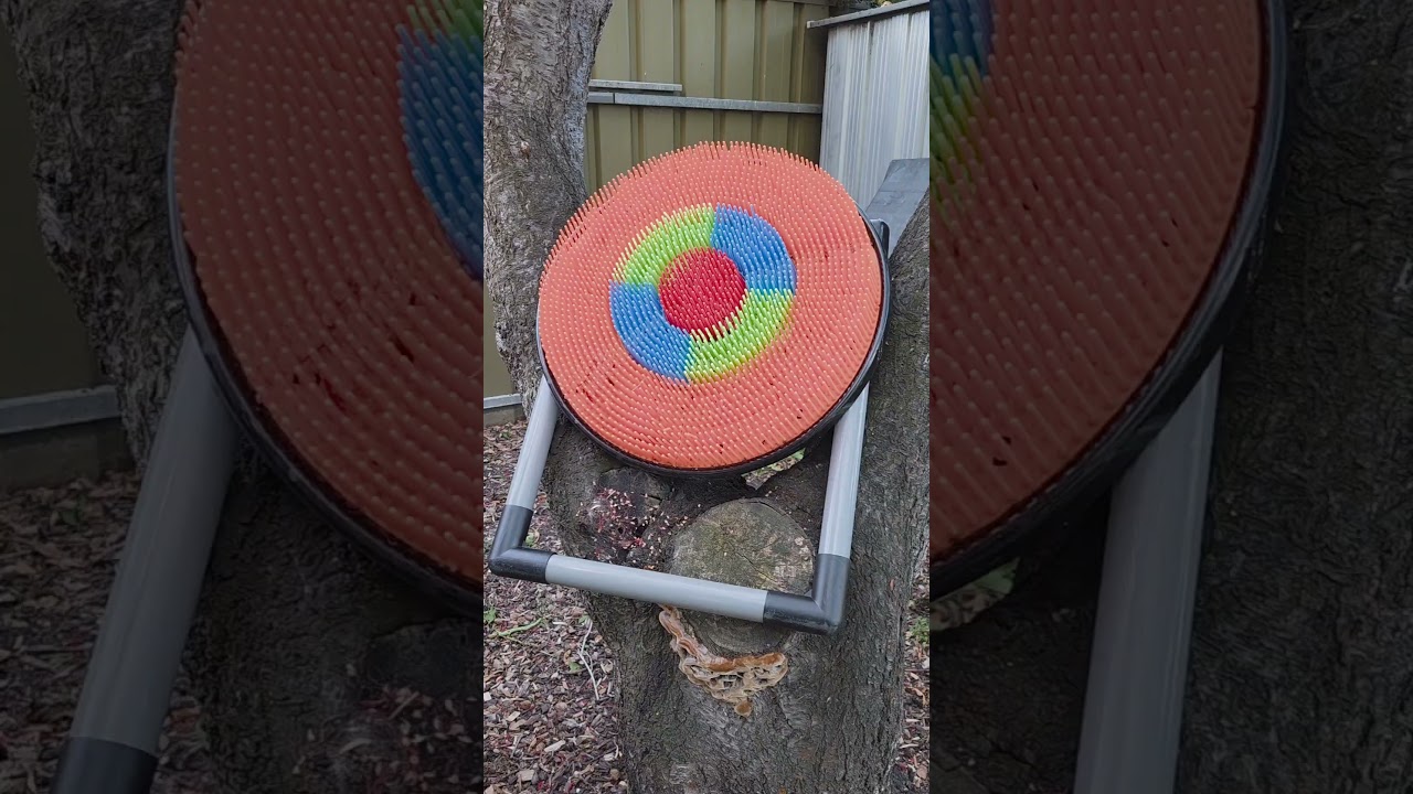 Nox hits archery target with an AXE while FRONT FLIPPING!
