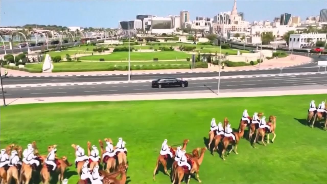 Trump welcomed to Qatar with red Cybertrucks, mounted camels and dancers