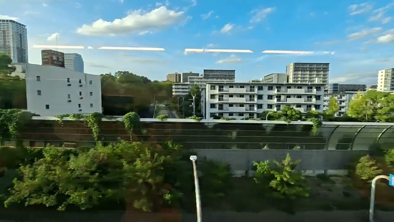 From train - another video of Japan - enjoy! Blue sky, green... WHERE? Monorail in Osaka?