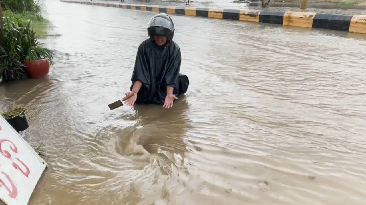 Rain flooding road after heavy rain
