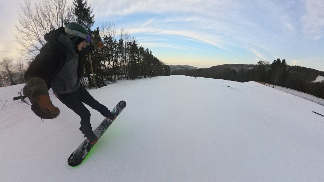 Snowboarding and working on 180's at Greek Peak