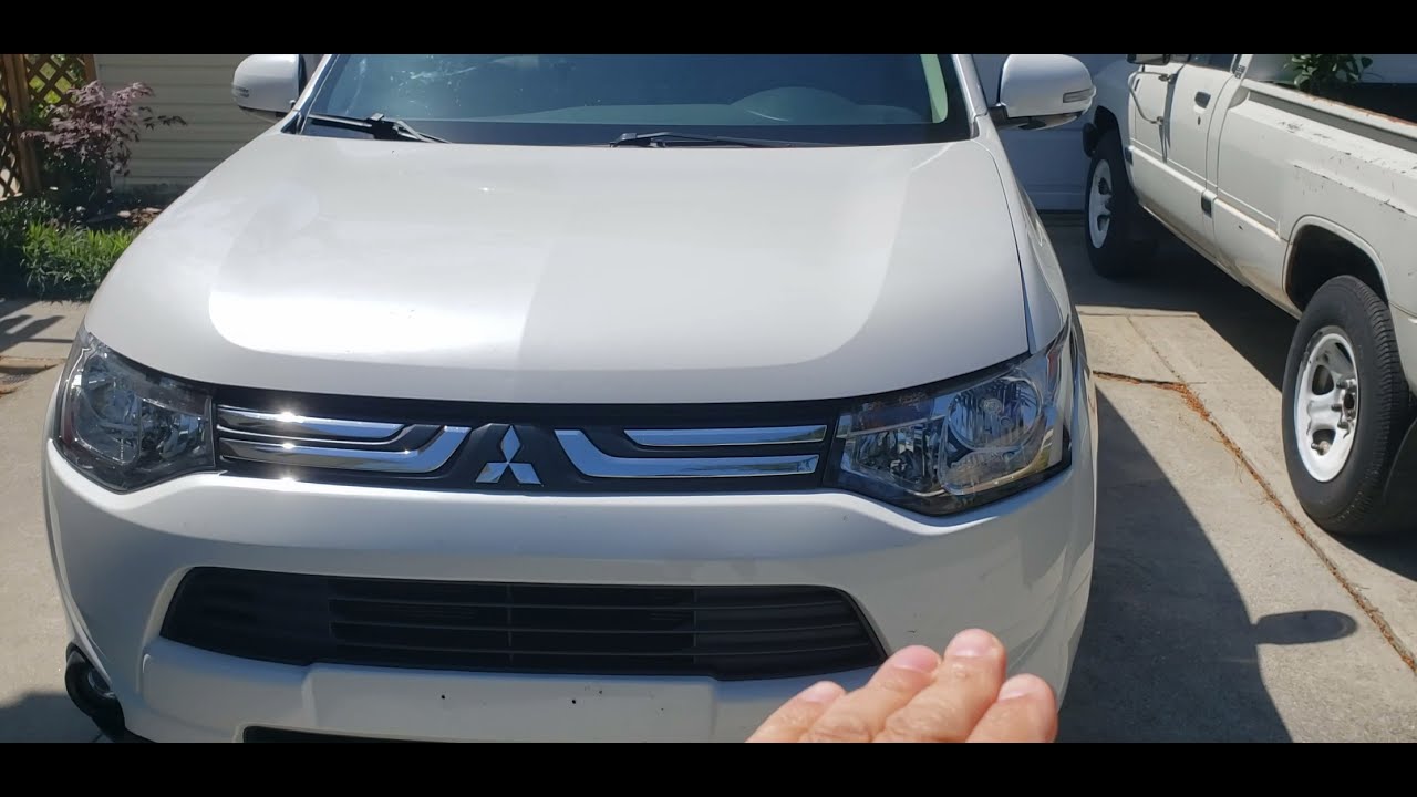 Cómo se ajusta focos delanteros de Mitsubishi Outlander 2014