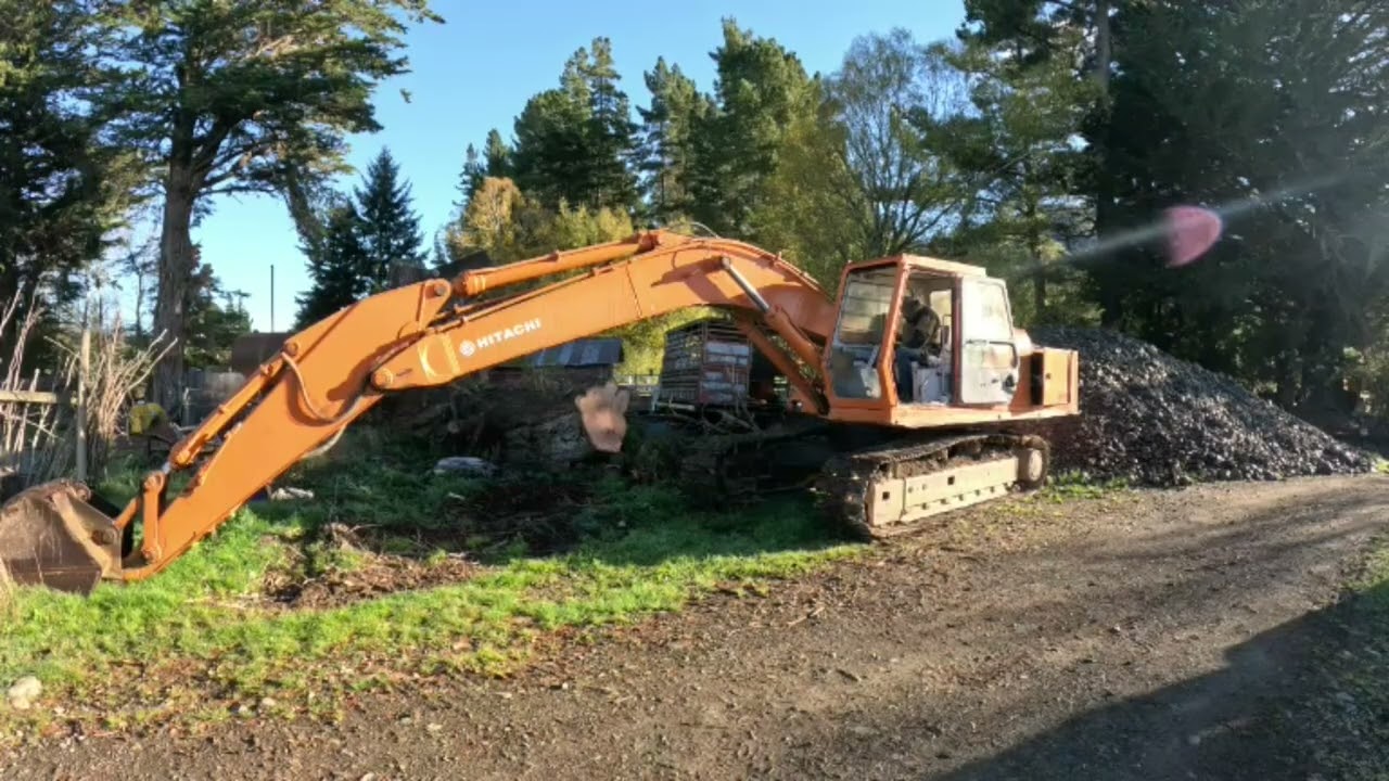 Cutting down huge pine trees and cleaning up with Kubota KX080