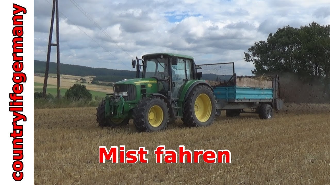 Mist fahren mit John Deere 6330 und New Holland
