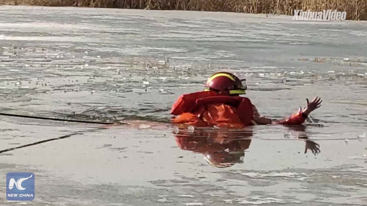 Two children fall through ice on frozen lake, rescued by firefighters