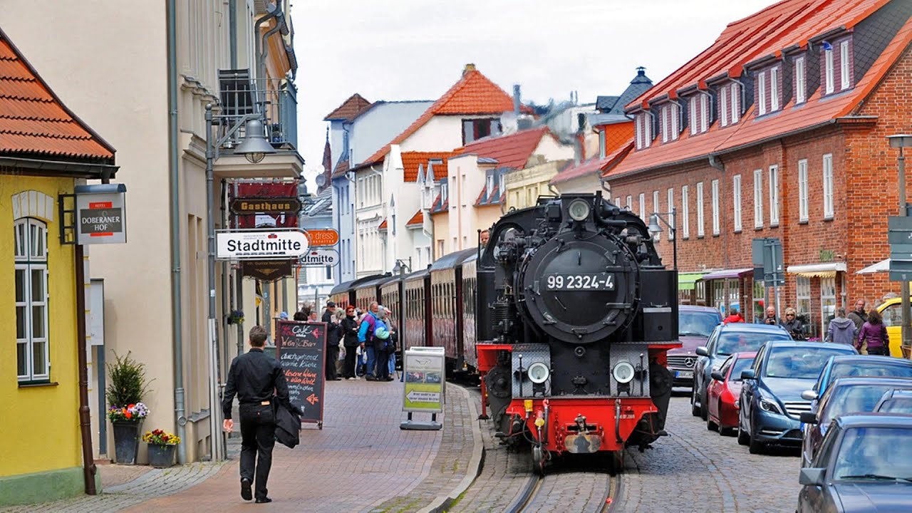 Steam Train driving on a Street | Molli-Bahn in Bad Doberan | Germany