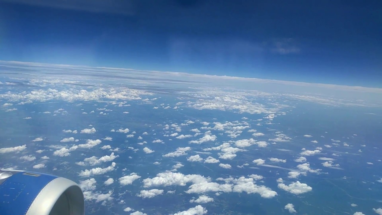 Time Lapse -  Airplane above Cumulus and Altostratus