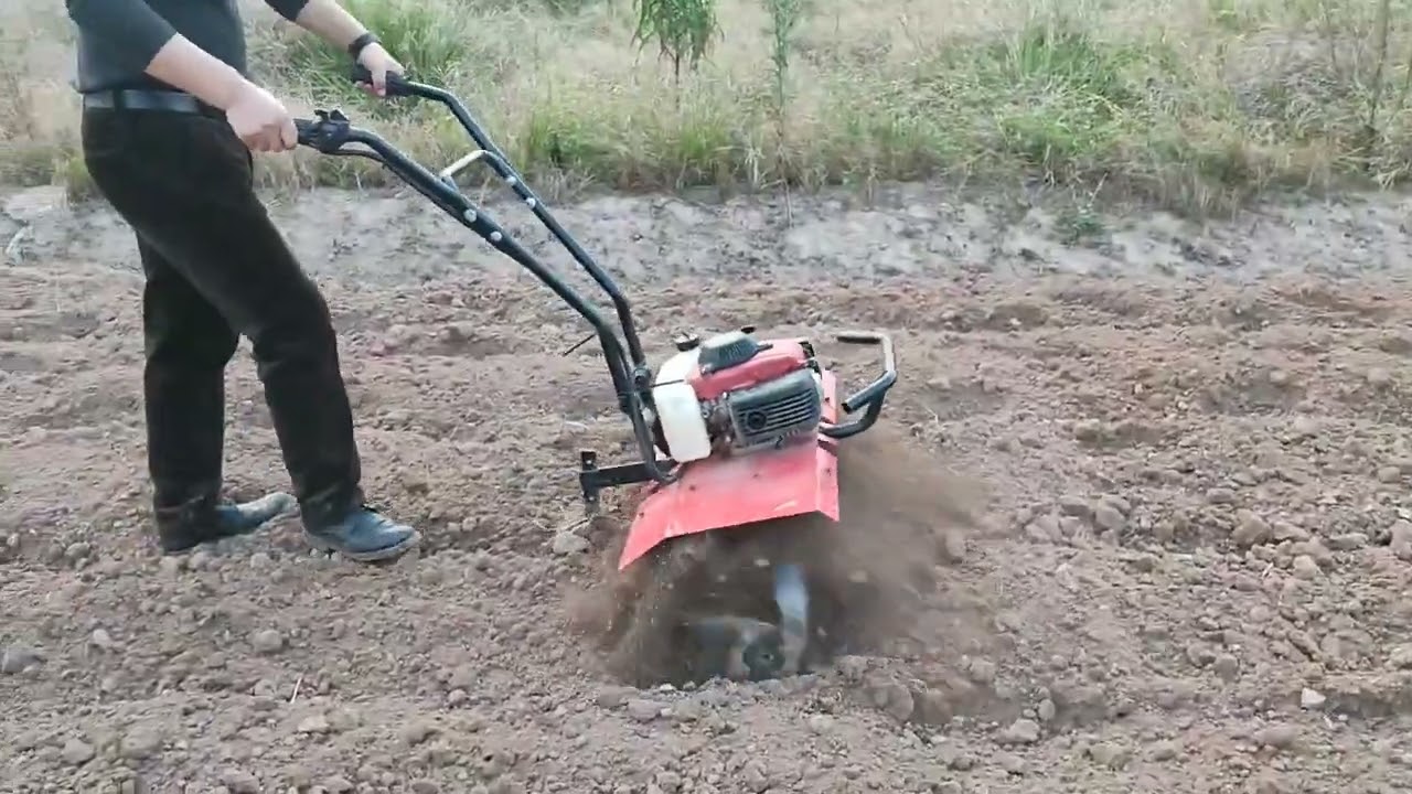 4 stroke mini gasoline tiller ; Tilling width could adjust from 460mm to 750mm .