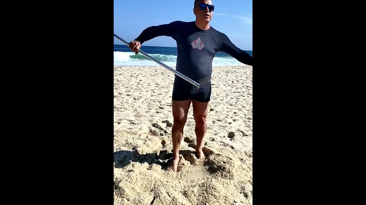 Como colocar Guarda Sol na areia da praia.