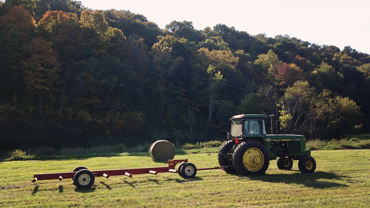 Hauling Round Bales to be sold - Bobcat S250, John Deere 4640