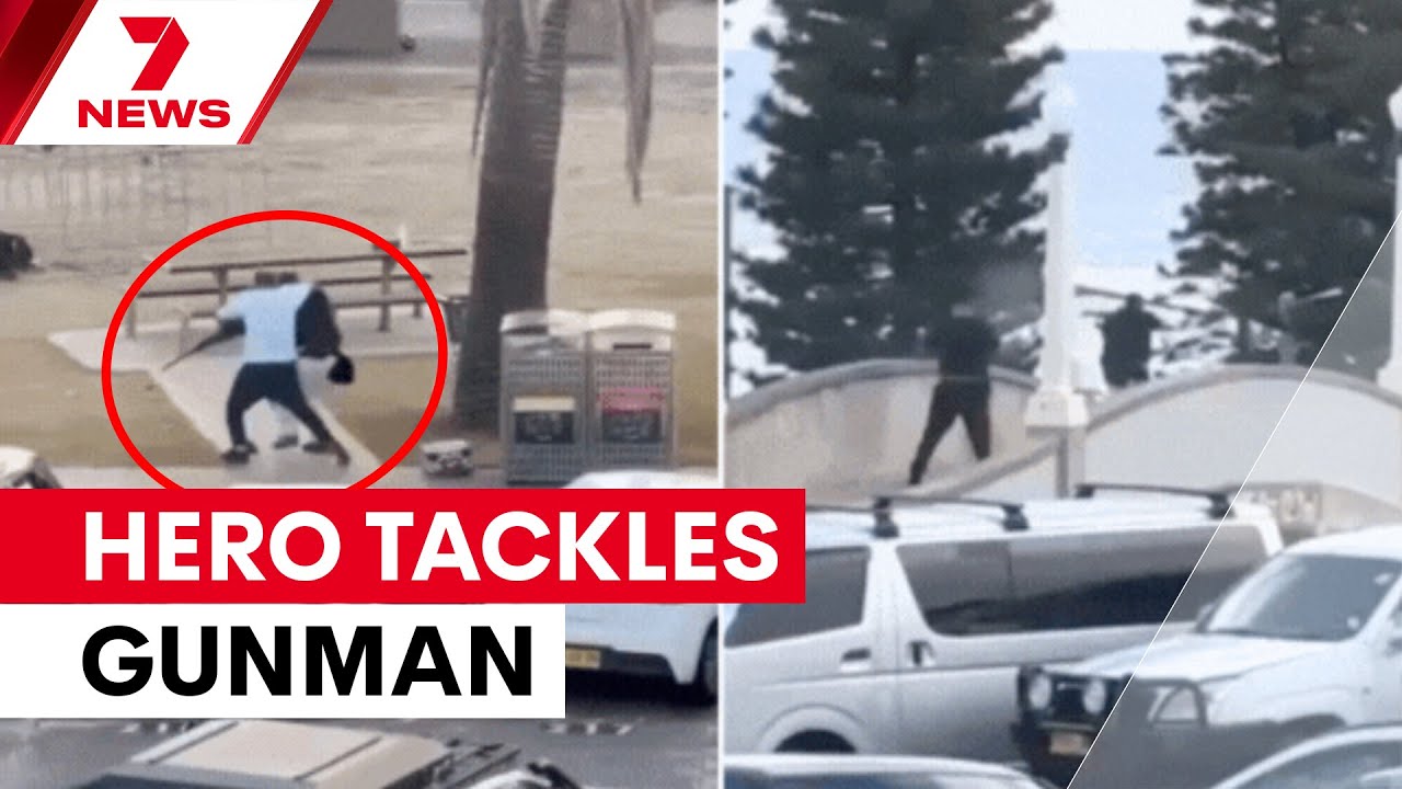 Incredible footage shows hero tackling gunman at Bondi beach shooting | 7NEWS