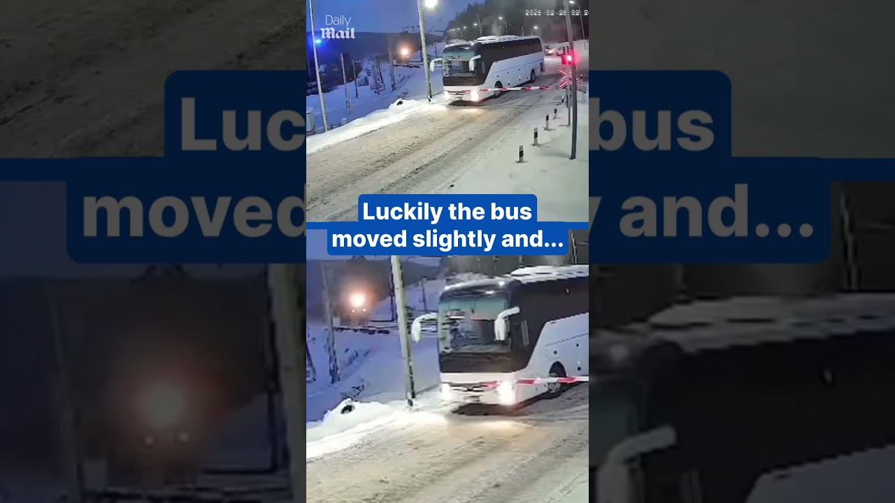 Bus narrowly misses train collision