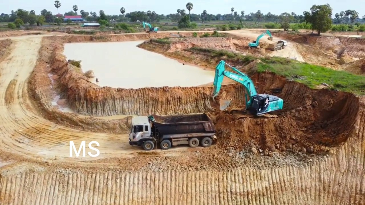 Work on site with excavators and earthmoving trucks