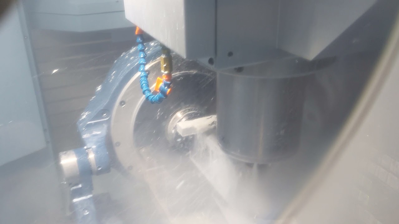 Matsuura MAM72-35V roughing with tailstock and RWP dovetail fixture.