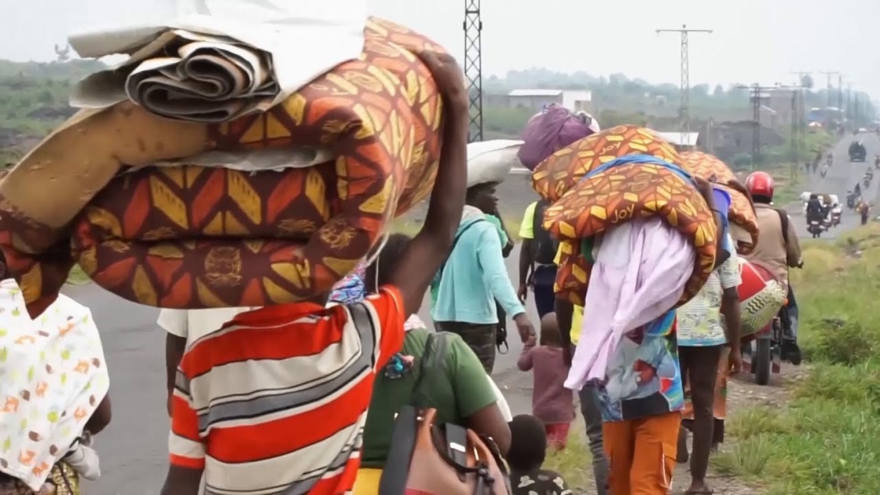 Civilians flee as fighting between M23 rebels and Congolese army approaches provincial capital
