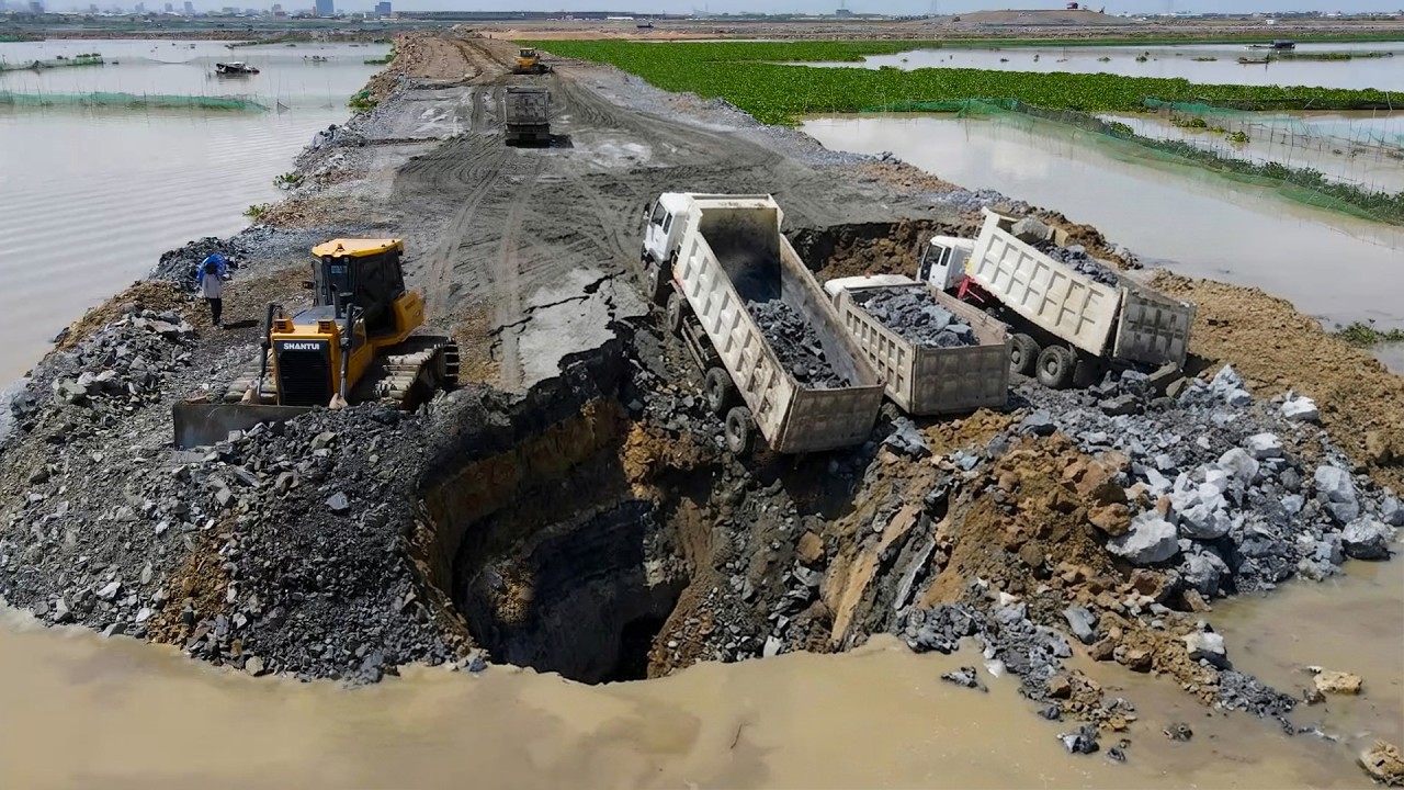 Stay Tuned! Will Be Use Heavy Dump Truck Bulldozer Fill Stone The Flooded Area Will set land borders