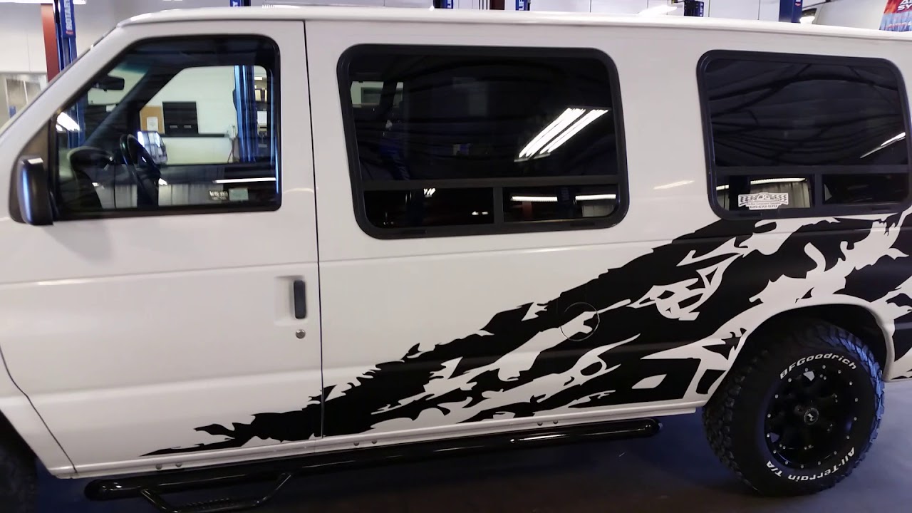 1996 Ford E150 lifted on 32 inch tires.