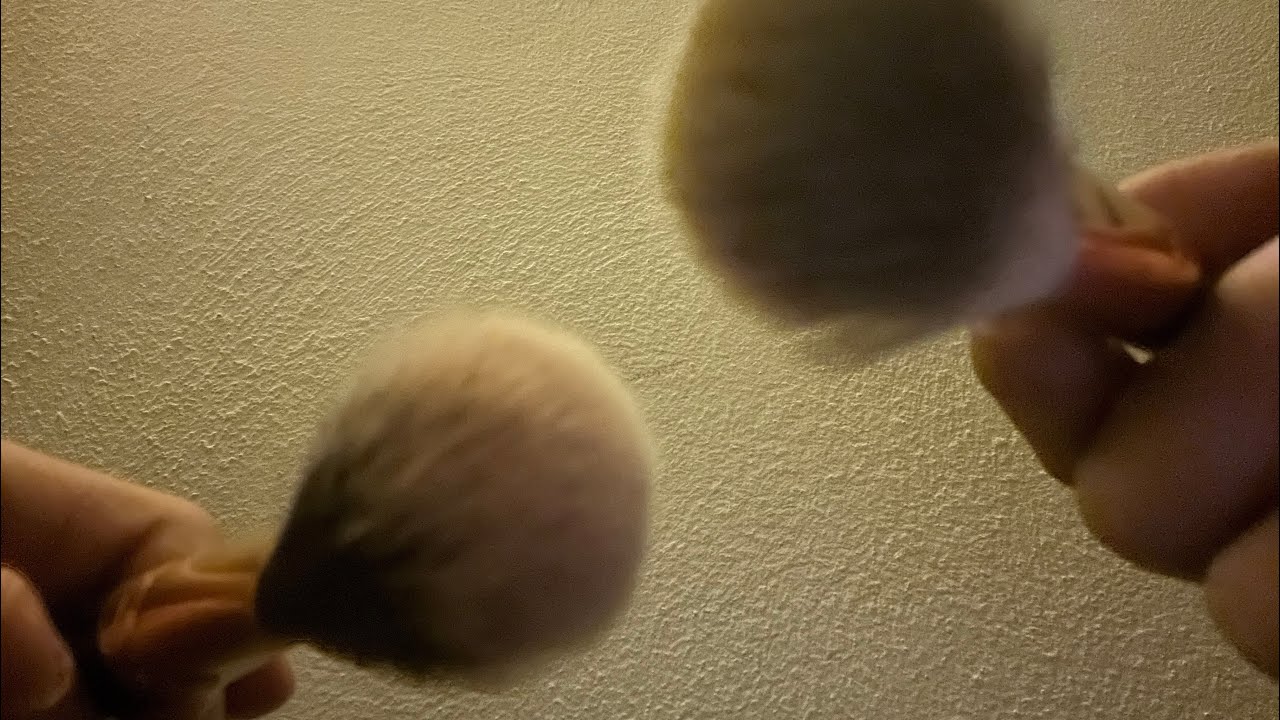 ASMR whispering and brushing your face 