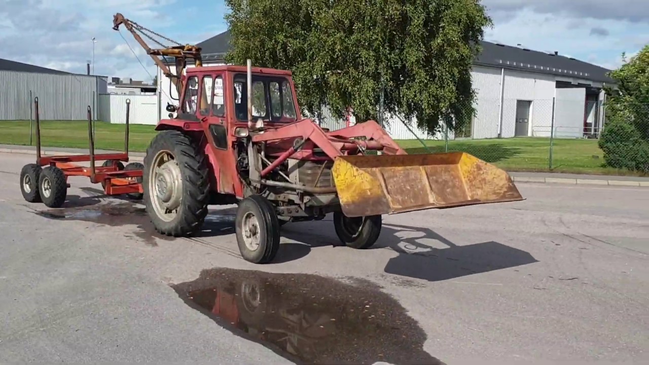 Köp Traktor med vajerkran & timmervagn på Klaravik