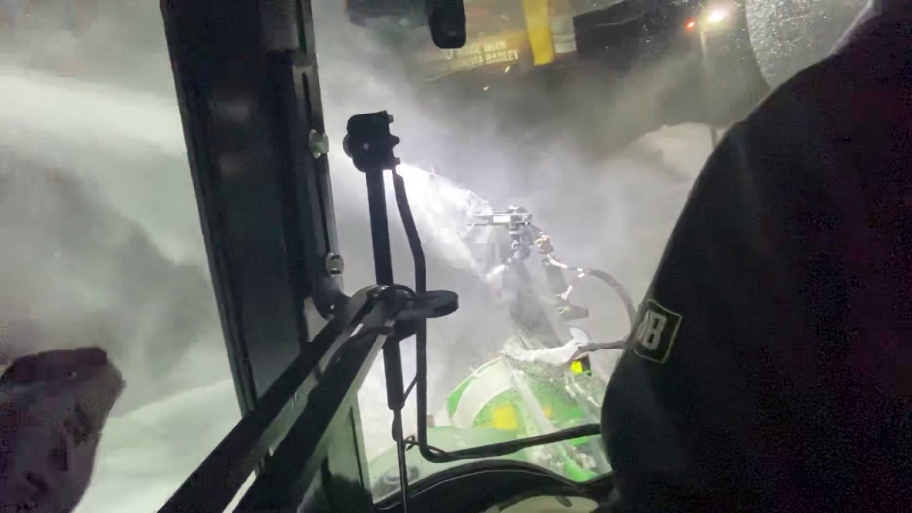 Blowing back snow piles with Pronovost 80” cyclone and John Deer 4066R