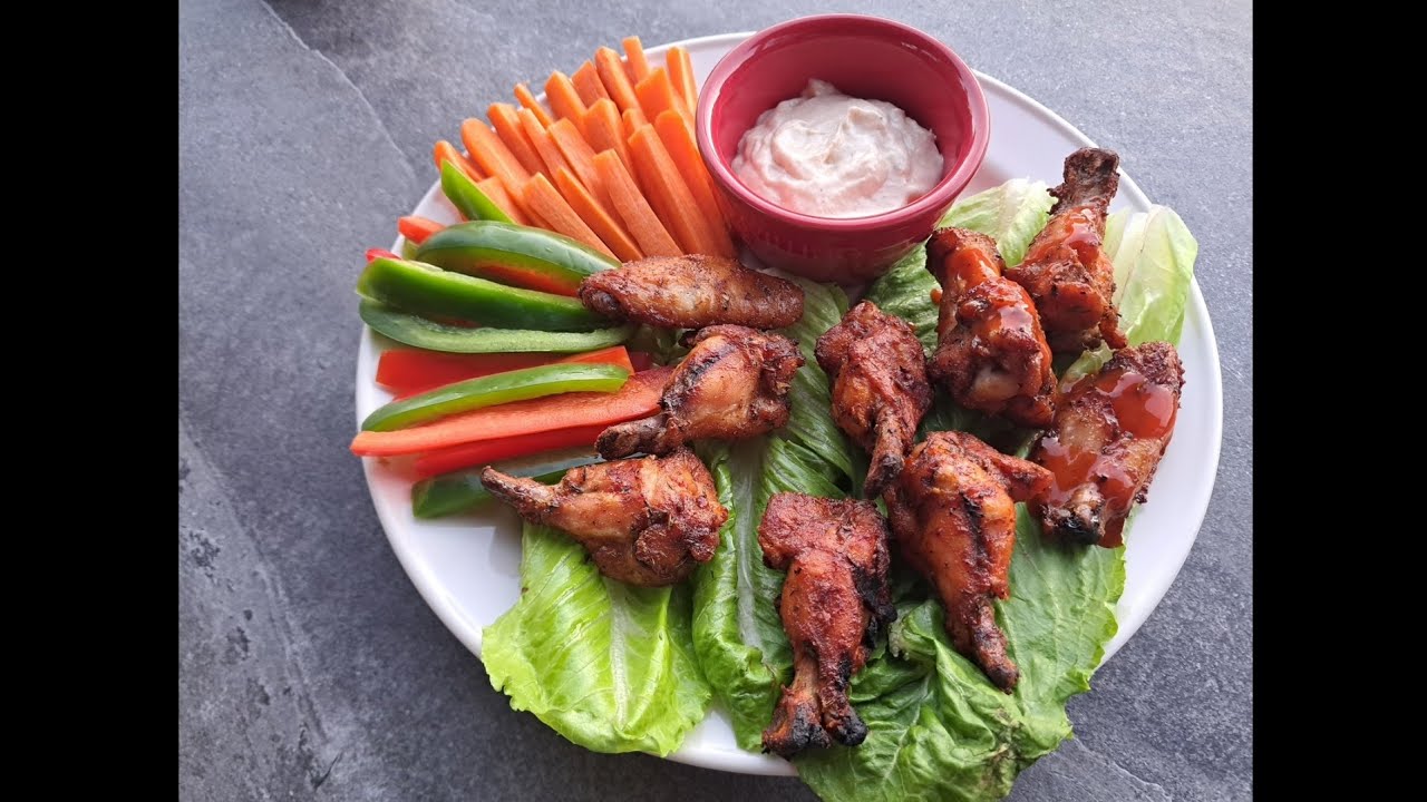 Ailes de poulet avec saumure  et laque de sauce en fin de cuisson