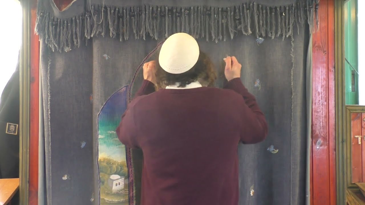 כ