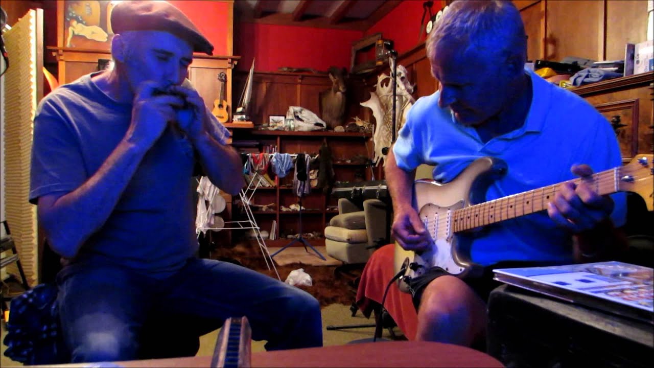 Harmonica & Electric guitar blues. Song starts at 50 seconds