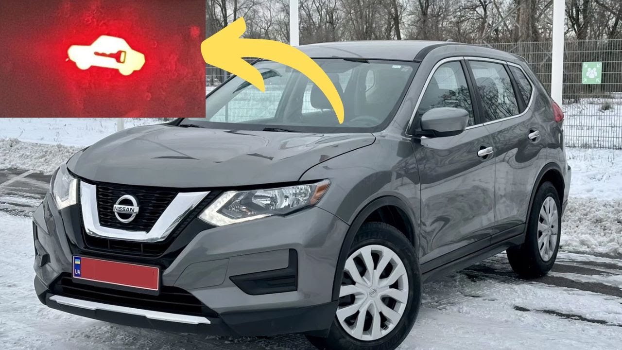 Красный автомобиль с символом ключа на приборной панели в автомобилях Nissan