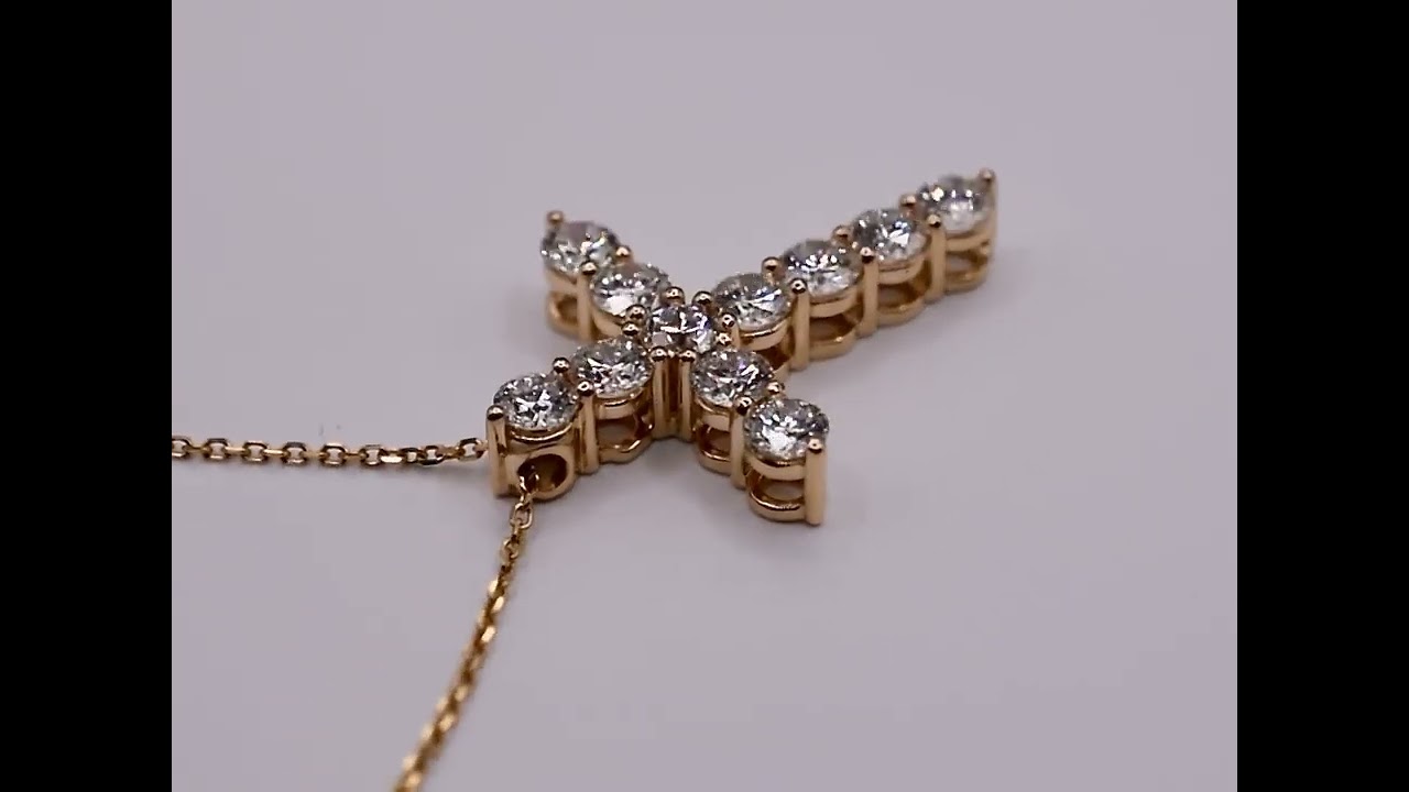 Diamond cross set in 14k yellow gold produced by Europa Imports LLC