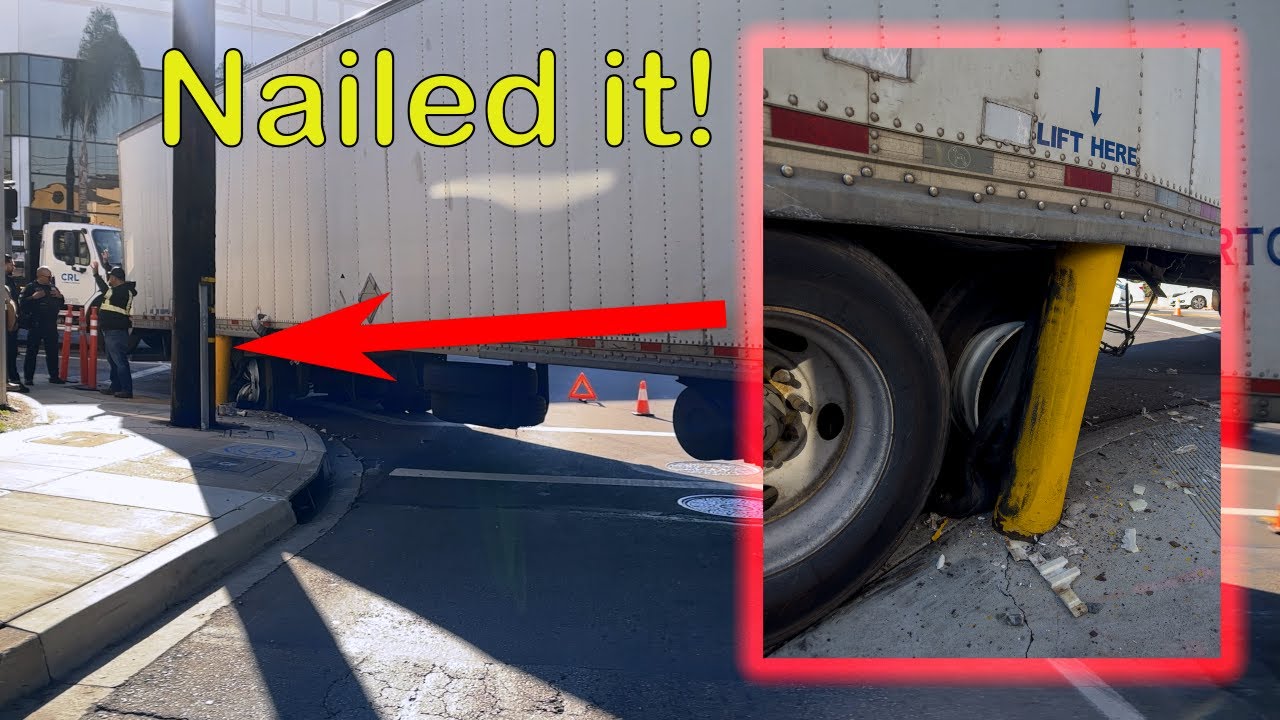 SWING WIDE! Rotator rescues trailer stuck on yellow concrete pole