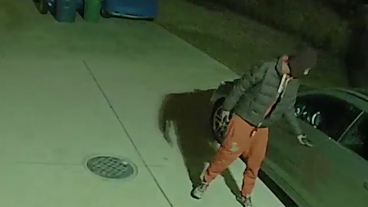 Armed and bold: Security footage shows suspect cover cameras during car break-ins