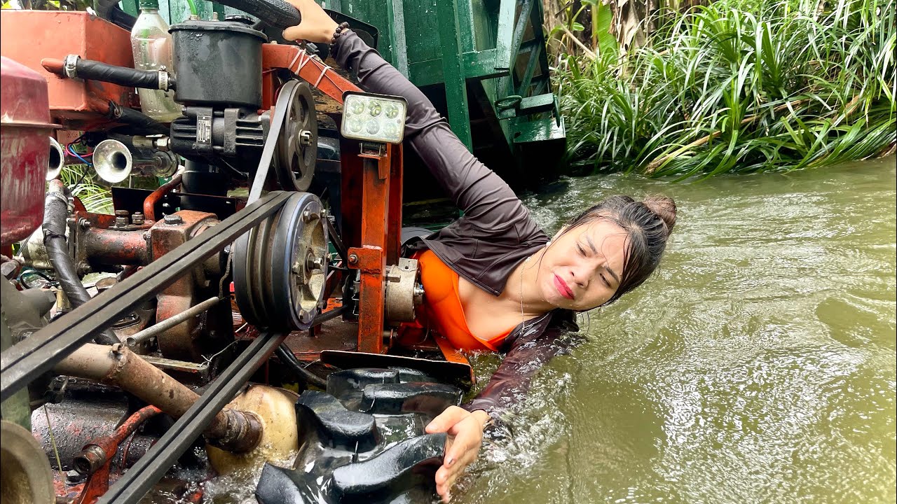 Female mechanic delivers mini tractor to customer