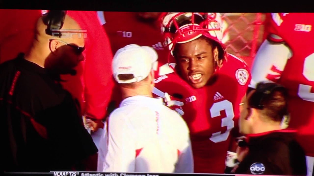 Nebraska HC Bo Pelini getting feedback from player Daimion Stafford