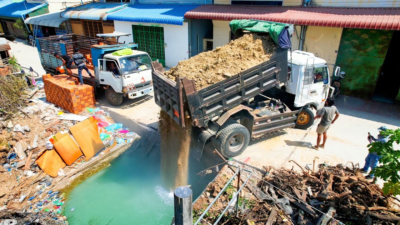 Start amazing project with bulldozer D20P push stone for fill up the deep land flood complete 100 %